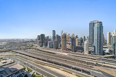 a view of a city with a highway and buildings at High-floor 2BR at Palladium, JLT - Near Metro in Dubai