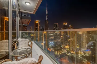 a balcony with chairs and a view of the city at Stunning Burj Khalifa View 5 Star Hotel Amenities in Dubai