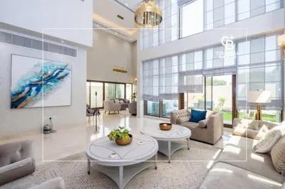 a living room with a couch and a table at Luxurious Meydan Dubai Villa with Unparalleled Views in Dubai