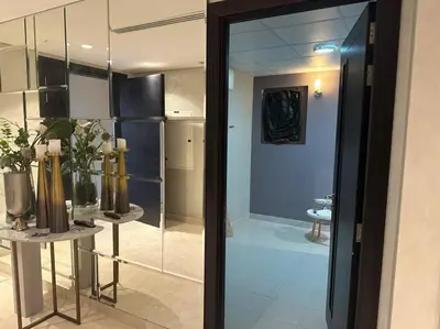 a glass door leading into a room with a kitchen at Luxurious Meydan Dubai Villa with Unparalleled Views in Dubai