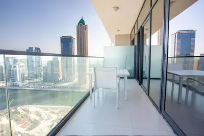 a balcony with a table and chairs in a building at Dubai Burj KHALIFA VIEW SMART HOME ZADA TOWER in Dubai