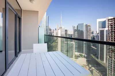 a balcony with a view of a city skyline at Dubai Burj KHALIFA VIEW SMART HOME ZADA TOWER in Dubai