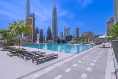 a swimming pool on the roof of a building at Vogue Downtown Views II with Direct Access to Dubai Mall Via a Climate Controlled Bridge, Two Bedroom Apartment with Balcony and Burj Khalifa View in Dubai
