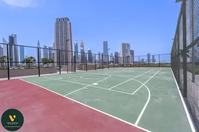 a tennis court in the middle of a city at Vogue Downtown Views II with Direct Access to Dubai Mall Via a Climate Controlled Bridge, Two Bedroom Apartment with Balcony and Burj Khalifa View in Dubai