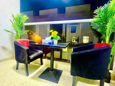 a dining room with a table and two chairs at Brand New Studio Near ADCB Metro in Dubai