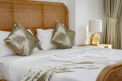 a bedroom with a bed with two towels on it at La Mer 1bedroom Private Beach in Dubai