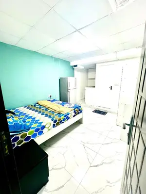 a bedroom with a bed in a room at Flat in Dubai Al Karama in Dubai