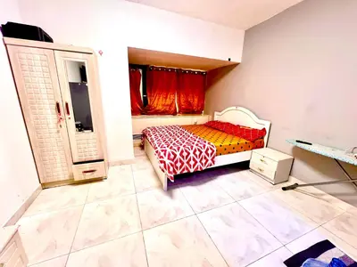 a small bedroom with a bed and a window at Flats in Dubai Emirates Tower Metro Station in Dubai