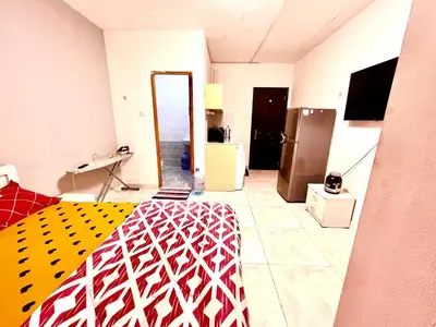 a living room with a kitchen and a room with a room at Flats in Dubai Emirates Tower Metro Station in Dubai