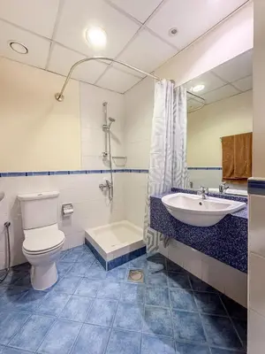 a bathroom with a toilet and a sink and a tub at Luxurious 2BR in Dubai Marina next to metro in Dubai