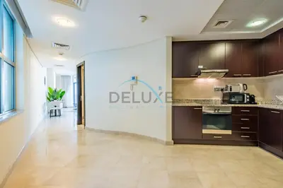 a kitchen with a sign that reads deluge roelandlords at Lively Studio in Sky Gardens, DIFC by Deluxe Holiday Homes in Dubai