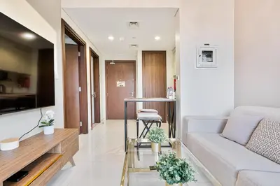 a living room with a couch and a table at Amazing 1BR APT with Burj Khalifa Views in Dubai
