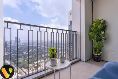 a balcony with a table and a view of a city at Vogue Downtown Views II with Direct Access to Dubai Mall Via a Climate Controlled Bridge, One Bedroom Apartment with Balcony and City View in Dubai