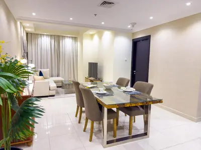 a dining room with a table and chairs at 1BHK in Business Bay near metro in Dubai