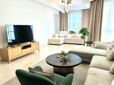 a living room with a couch and a tv at Luxury apartment in Business bay 5 people in Dubai