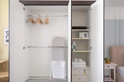 a room with a closet with white walls at Silkhaus Comfort Studio at Sky gardens-DIFC in Dubai