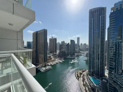 a view of a river in a city with buildings at SUNRISE HOMES - 2 BR with Panoramic Marina Views in Dubai
