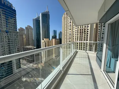 a balcony with a view of a city at SUNRISE HOMES - 2 BR with Panoramic Marina Views in Dubai