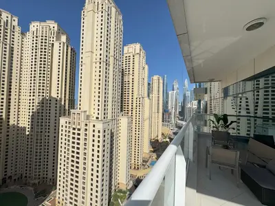 a view of a city from a balcony of a building at SUNRISE HOMES - 2 BR with Panoramic Marina Views in Dubai