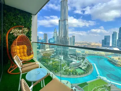 a balcony with a view of a city at Lux 2 King Bed Suite - Grande Signature Residences in Dubai