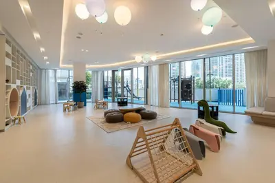 a large living room with a lot of windows at Lux 2 King Bed Suite - Grande Signature Residences in Dubai