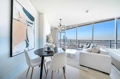 a living room with a table and a couch at Silkhaus Gallery Studio at Sky Gardens in Heart of DIFC in Dubai