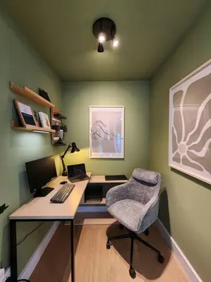 a office with a desk with a computer and a chair at Next to METRO 1BED with Panoramic Lake View in Dubai
