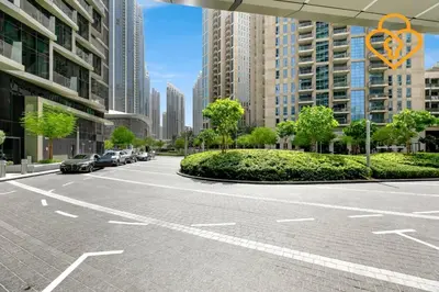 an empty parking lot in a city with tall buildings at Keysplease 2 BR Address Opera walking to Dubai Mall 55 in Dubai