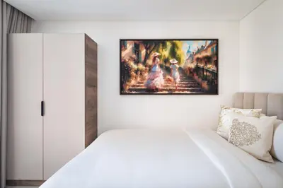 a white bedroom with a painting on the wall at Downtown Luxury Treat - Premium Location! 2 bedroom! in Dubai