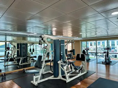 a gym with several tread machines in a building at 2BR on 30th Floor in JLT Near Metro & Walking Distance to JBR Beach, Dubai Marina in Dubai