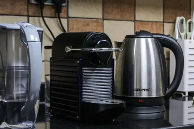 a coffee maker sitting on top of a counter at 2BR on 30th Floor in JLT Near Metro & Walking Distance to JBR Beach, Dubai Marina in Dubai