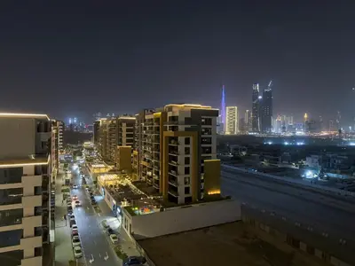 a view of a city at night with buildings at Luxury 3BR near to Downtown - Burj Khalifa & Pool Views - 10 min to Dubai Mall in Dubai