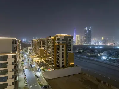 a view of a city at night with buildings at Luxury 3BR near to Downtown - Burj Khalifa & Pool Views - 10 min to Dubai Mall in Dubai