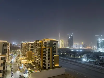 a view of a city at night with buildings at Luxury 3BR near to Downtown - Burj Khalifa & Pool Views - 10 min to Dubai Mall in Dubai