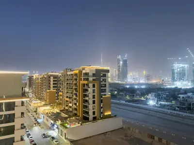 a view of a city at night with tall buildings at Luxury 3BR near to Downtown - Burj Khalifa & Pool Views - 10 min to Dubai Mall in Dubai