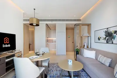 a living room with a couch and a table at 1BHK with Marina Views and Beach Access in Dubai