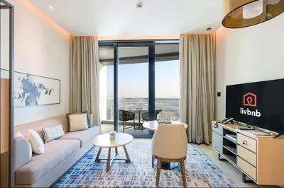 a living room with a couch and a table at 1BHK with Marina Views and Beach Access in Dubai