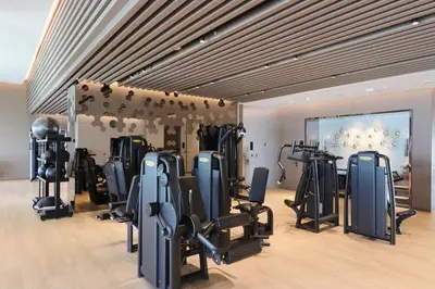 a gym with treadmills and exercise equipment in a room at 1BHK with Marina Views and Beach Access in Dubai