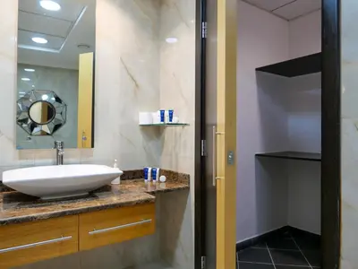 a bathroom with a sink and a mirror at Spacious 4BR Duplex with Terrace - JBR in Dubai