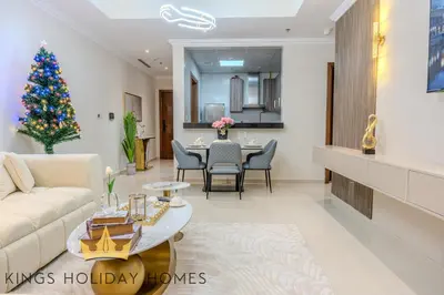 a living room with a christmas tree in it at Luxury Apartments Dunya tower Burj Khalifa St kings in Dubai