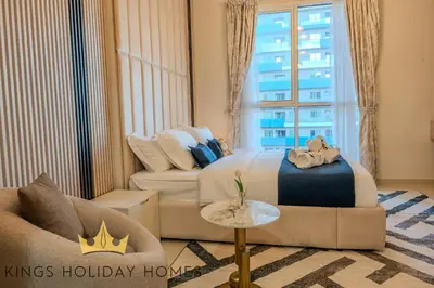 a hotel room with a bed and a couch at Luxury Apartments Dunya tower Burj Khalifa St kings in Dubai