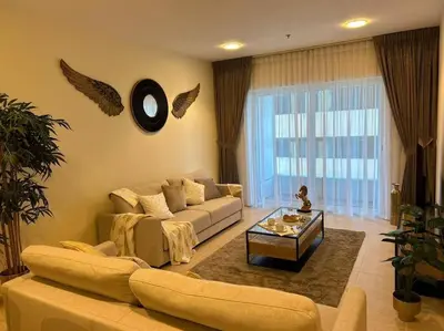 a living room with a couch and a coffee table at 1BHK in Dubai Marina near tram in Dubai