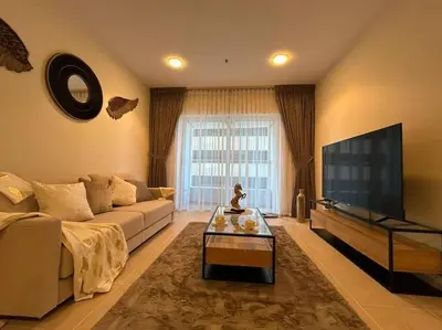a living room with a couch and a flat screen tv at 1BHK in Dubai Marina near tram in Dubai