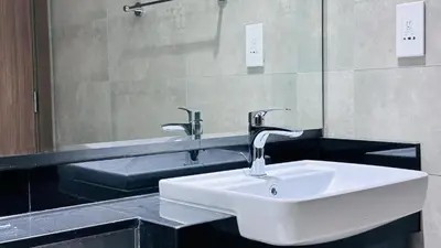 a bathroom with a sink and a mirror at Sunday Sheikh Zayed Road Concord Tower 2 BR by Belvilla in Dubai