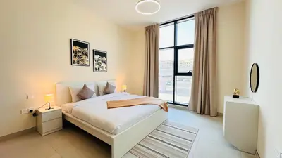 a bedroom with a bed and a large window at Sunday Sheikh Zayed Road Concord Tower 2 BR by Belvilla in Dubai