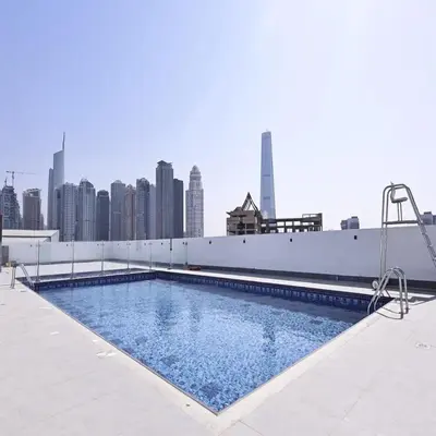 a swimming pool on top of a building with a city skyline at Sunday Sheikh Zayed Road Concord Tower 2 BR by Belvilla in Dubai