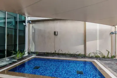 a swimming pool in the middle of a building at Stylish 1-BR Oasis Minutes from Burj & Dubai Mall in Dubai