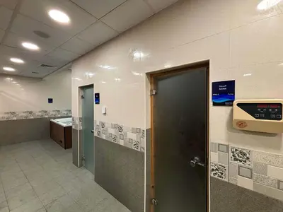a hospital hallway with a door in a room at Frank Porter - Wavez Residence in Dubai