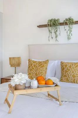 a tray of fruit sitting on top of a bed at Frank Porter - Damac Heights in Dubai