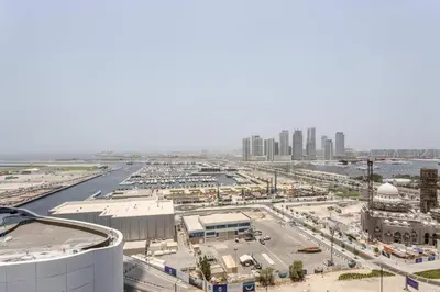 an aerial view of a city with a harbor at Frank Porter - Damac Heights in Dubai
